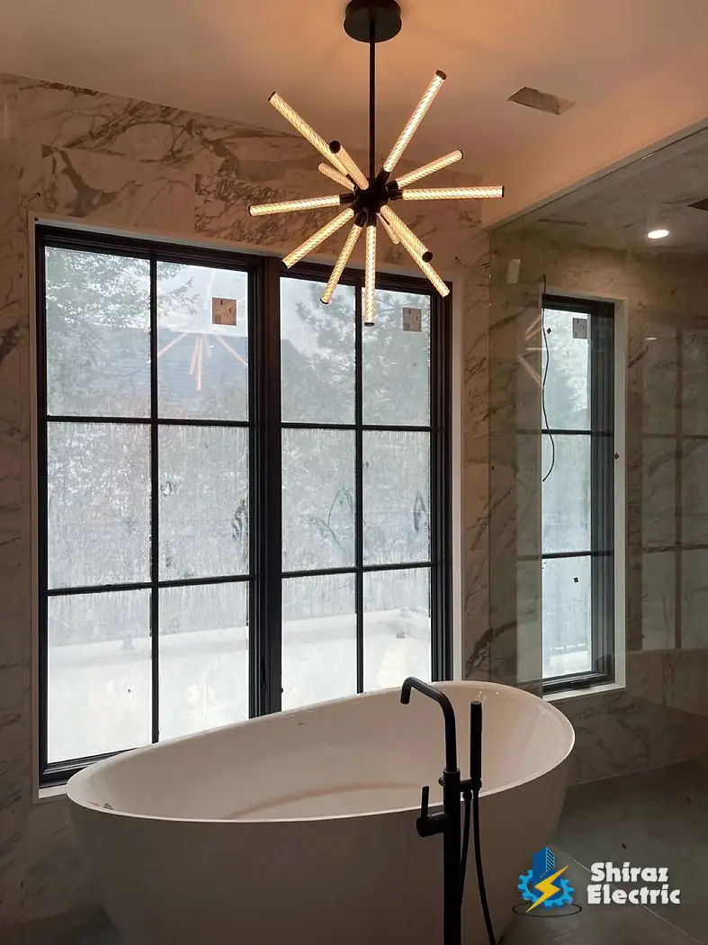 Tub area with chandelier